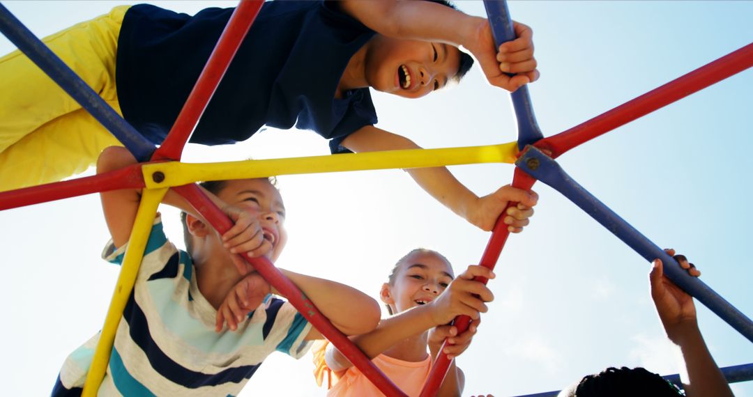 Happy Children Climbing Playground Equipment Outdoors - Free Images, Stock Photos and Pictures on Pikwizard.com