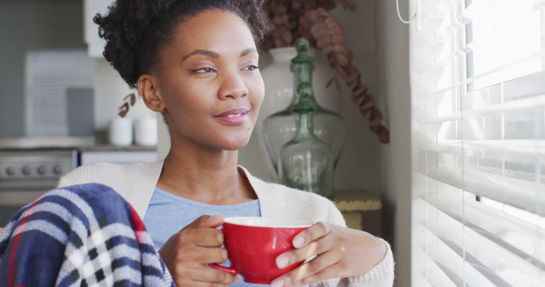 Thoughtful Woman Enjoying Coffee Relaxing by Window