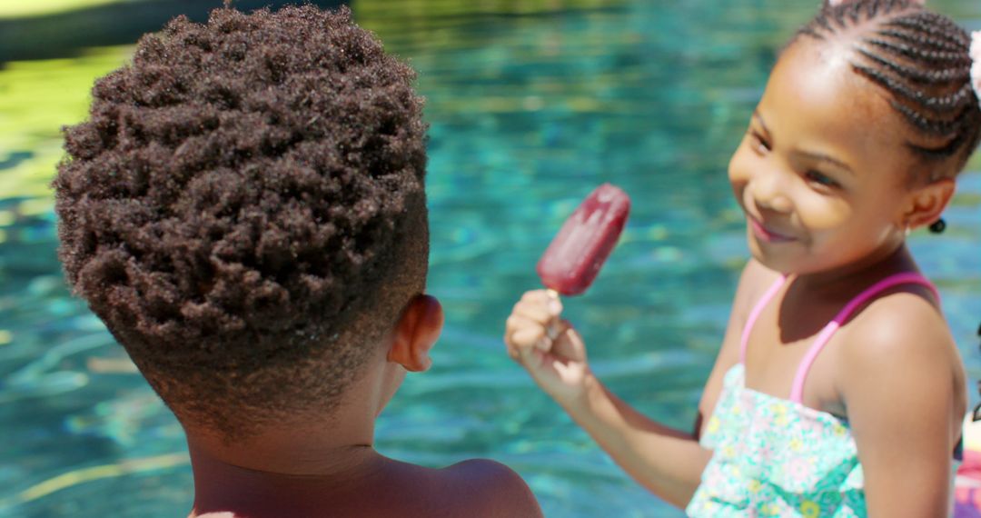 Children Enjoying Poolside Popsicle On A Sunny Day - Free Images, Stock Photos and Pictures on Pikwizard.com