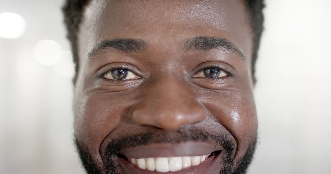 Close-Up of Smiling African American Man with Beard - Free Images, Stock Photos and Pictures on Pikwizard.com