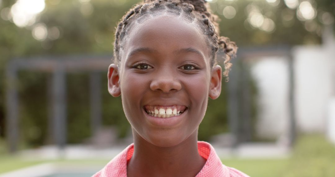 Cheerful Young African American Girl Smiling Outdoors - Free Images, Stock Photos and Pictures on Pikwizard.com