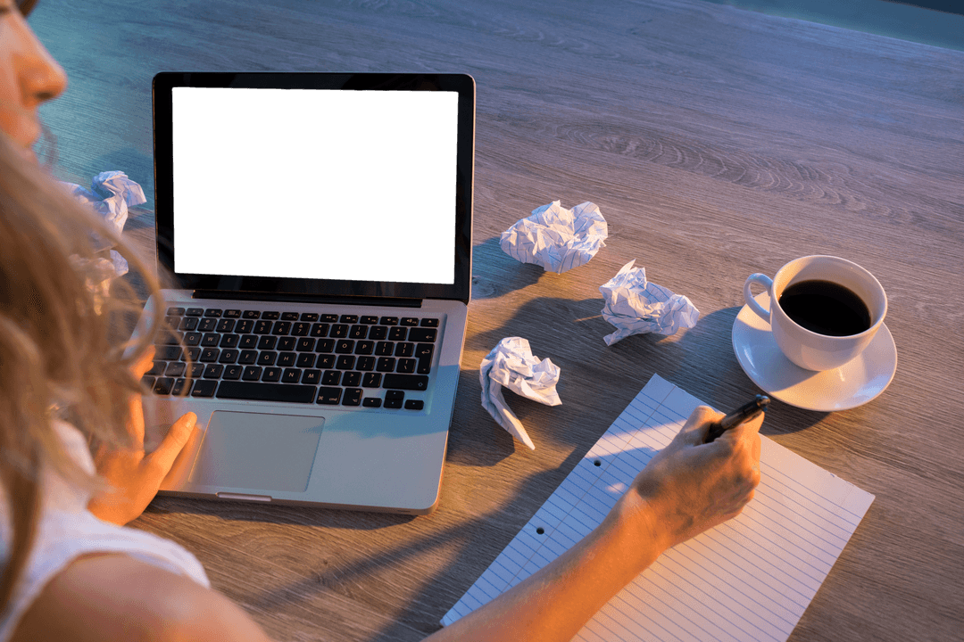 Writer at Work with Laptop and Coffee on Desk, Transparent Crumpled Paper in Background