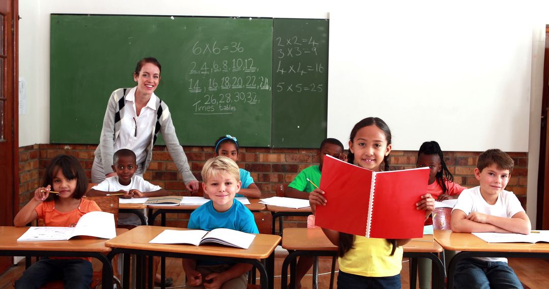 Diverse Students in Classroom with Teacher Smiling - Free Images, Stock Photos and Pictures on Pikwizard.com