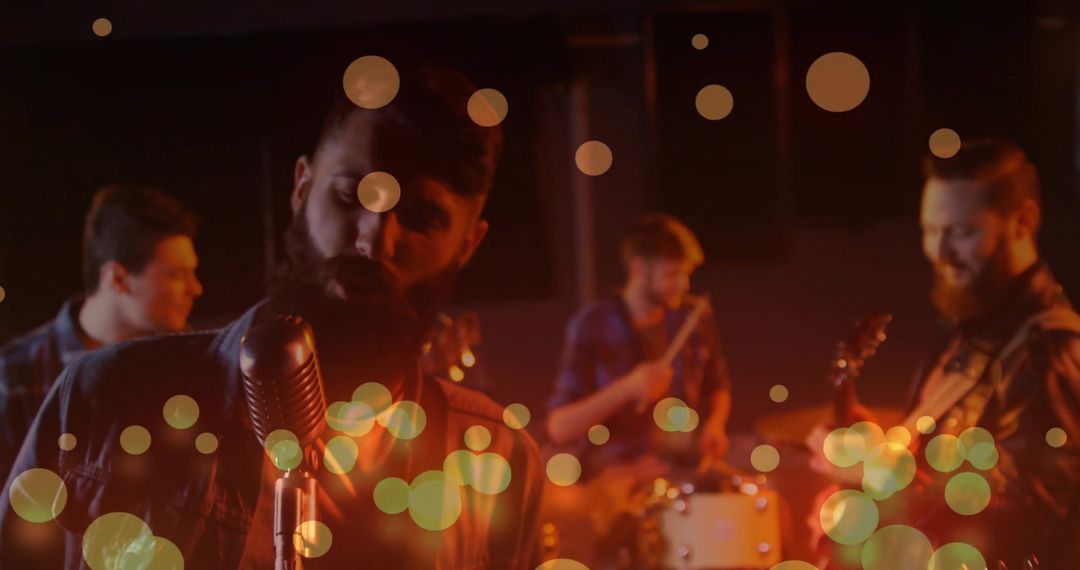 Band Performing Live on Stage with Vintage Microphone and Bokeh Lights