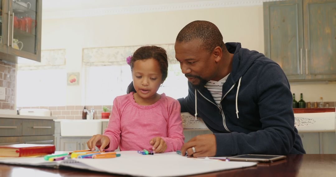 Father and Daughter Doing Homework at Home Together - Free Images, Stock Photos and Pictures on Pikwizard.com