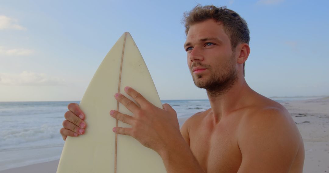 Young Surfer Contemplating by Ocean Shoreline