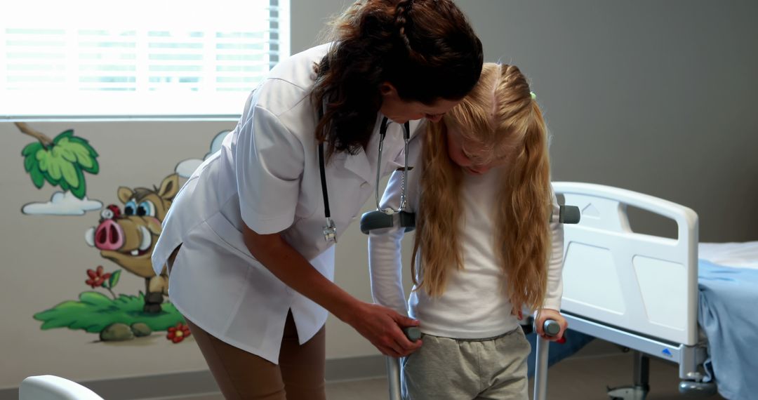 Female Doctor Assisting Child with Crutches in Hospital Room - Free Images, Stock Photos and Pictures on Pikwizard.com