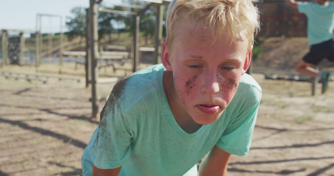 Tired Caucasian Boy Resting at Outdoor Bootcamp Course