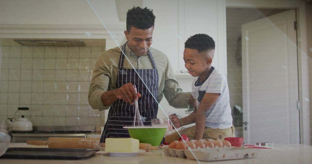 Father and Son Enjoying Baking Together in Kitchen