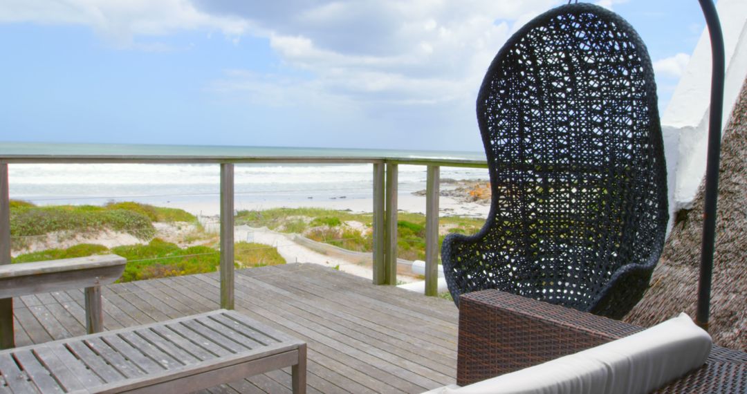 Coastal Balcony with Swing Chair Overlooking Ocean - Free Images, Stock Photos and Pictures on Pikwizard.com