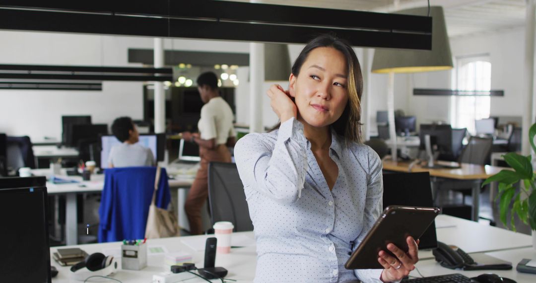 Professional Woman Tablet Workspace Open-Plan Office Environment