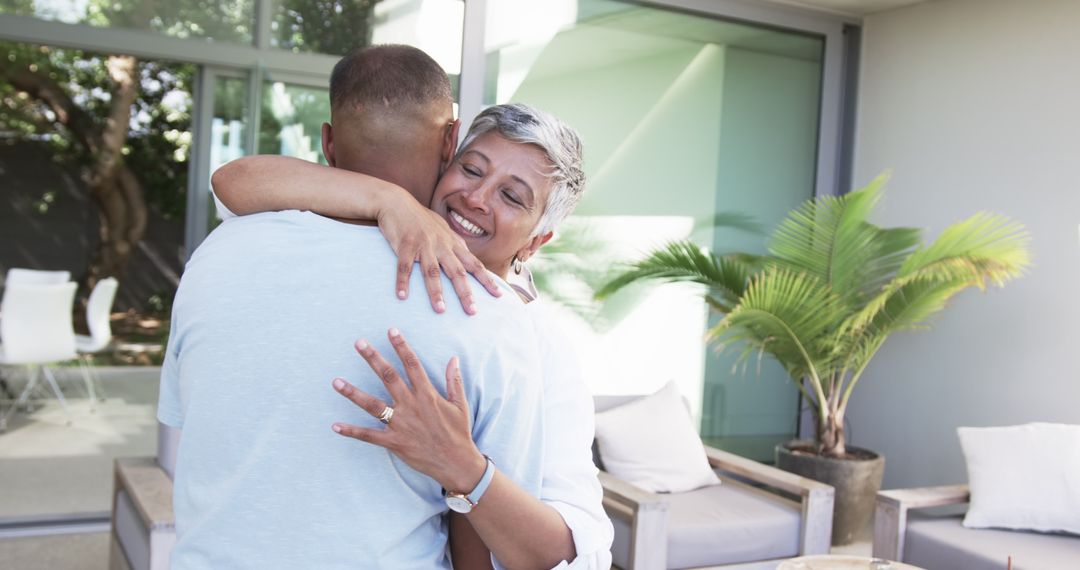 Joyful Embrace of an Affectionate Couple in Modern Outdoor Space