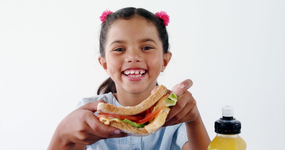 Smiling Girl Enjoying Healthy Sandwich with Copy Space