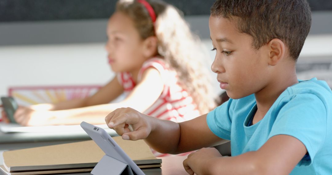 Diverse Kids Using Tablets in School Classroom