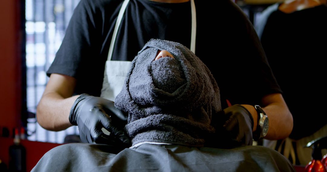 Barber Applying Hot Towel for Relaxing Shaving Experience - Free Images, Stock Photos and Pictures on Pikwizard.com