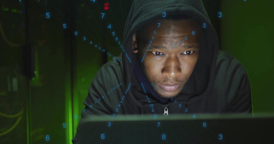 Focused Hooded Man Typing Commands in Futuristic Setting
