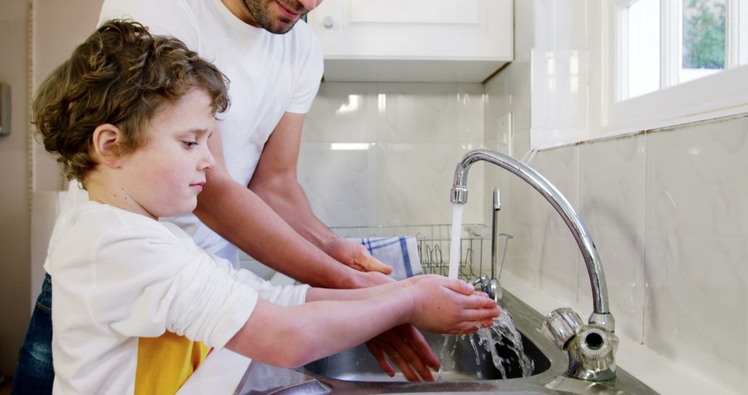 Father Teaching Son to Wash Hands at Kitchen Sink - Free Images, Stock Photos and Pictures on Pikwizard.com