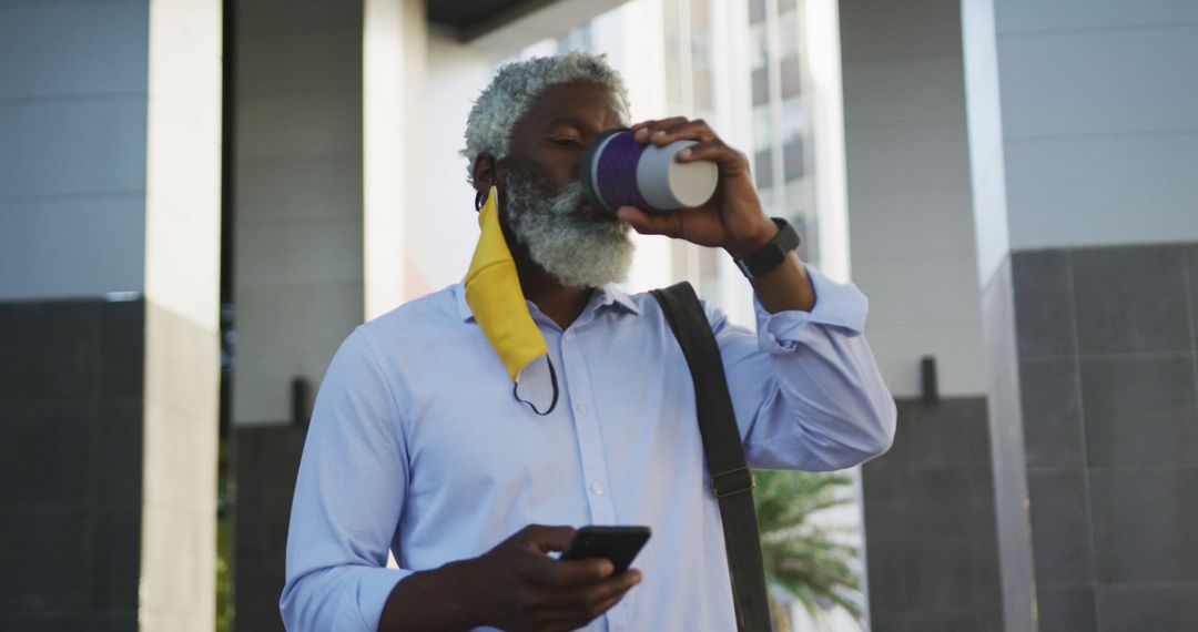 Senior Businessman Drinking Coffee While Using Smartphone Outdoors - Free Images, Stock Photos and Pictures on Pikwizard.com