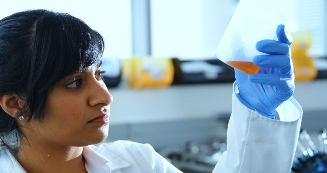 Female Scientist Analyzing Chemical Sample in Laboratory Setting - Free Images, Stock Photos and Pictures on Pikwizard.com