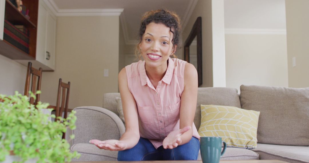 Smiling Woman Engaging in Video Call on Comfortable Sofa