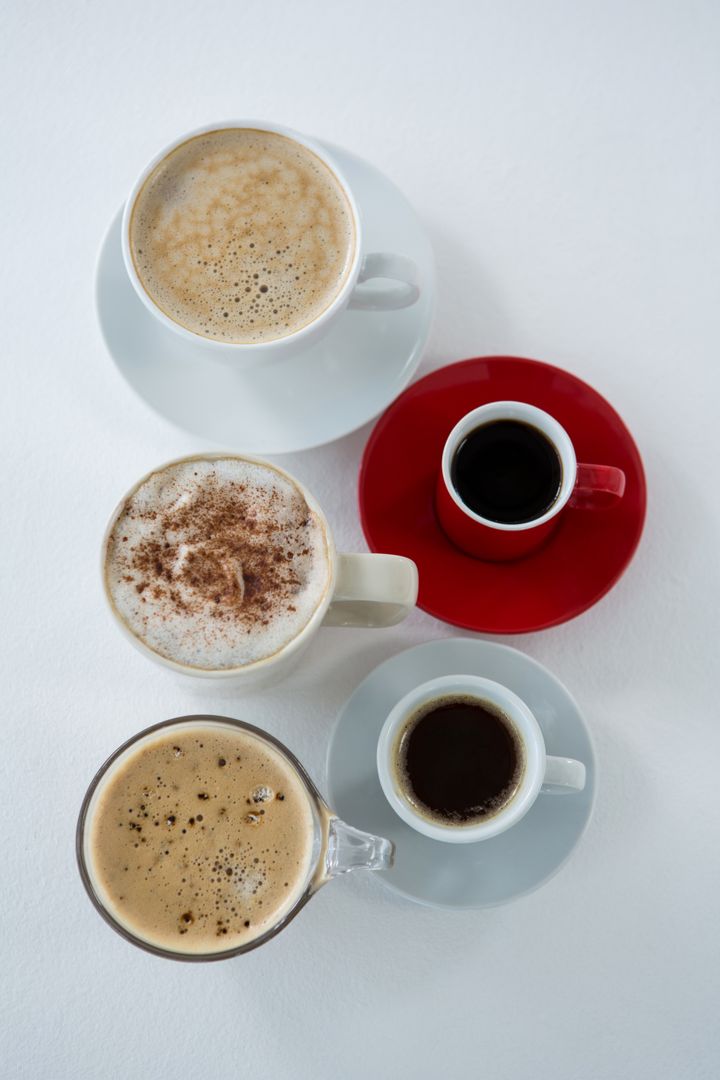 Different types of coffee arranged on white background - Free Images, Stock Photos and Pictures on Pikwizard.com