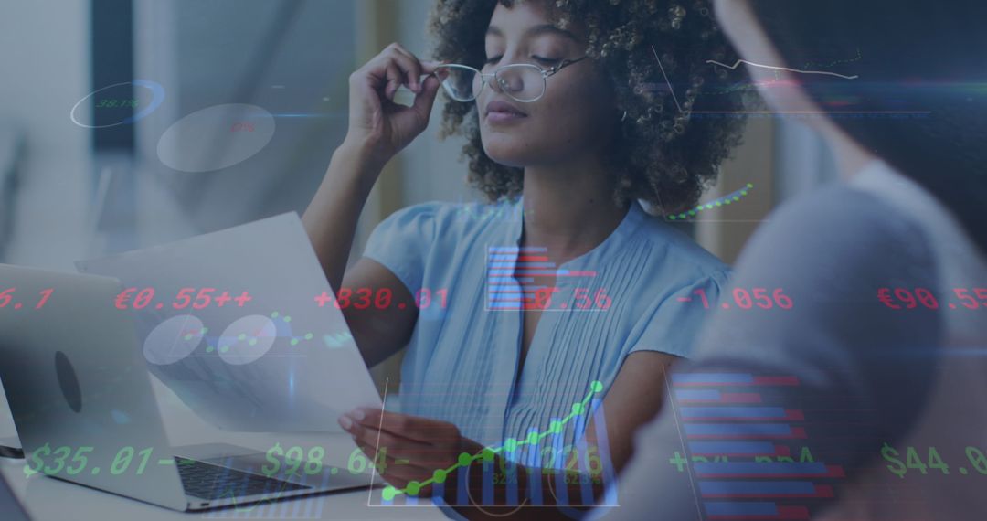 Diverse Businesswomen Analyzing Data with Digital Interface Disruption