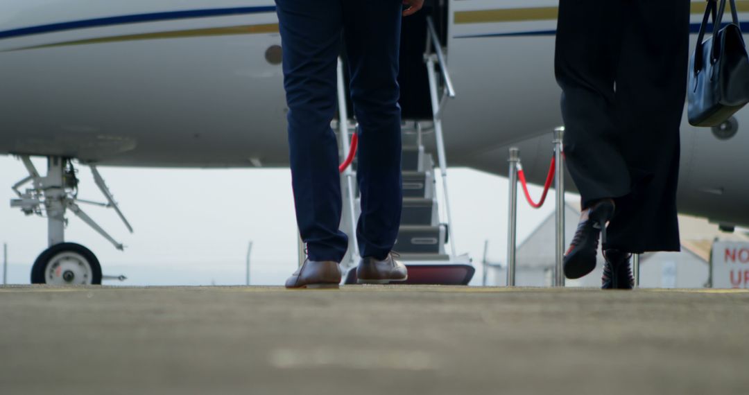 Business Professionals Boarding Private Jet for Corporate Travel