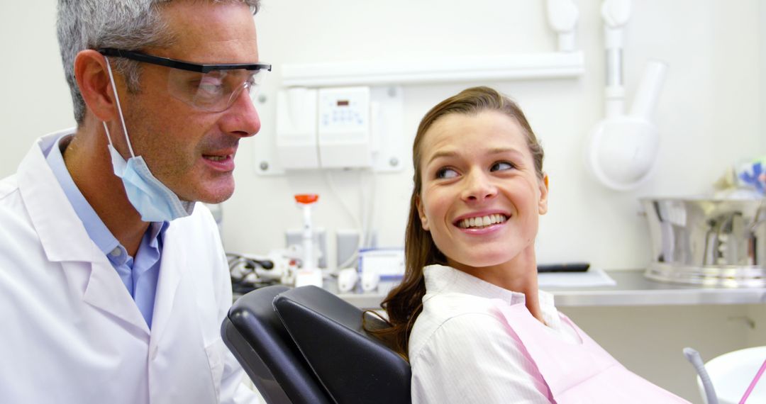 Young Woman Smiling After Dental Check-Up with Dentist - Free Images, Stock Photos and Pictures on Pikwizard.com