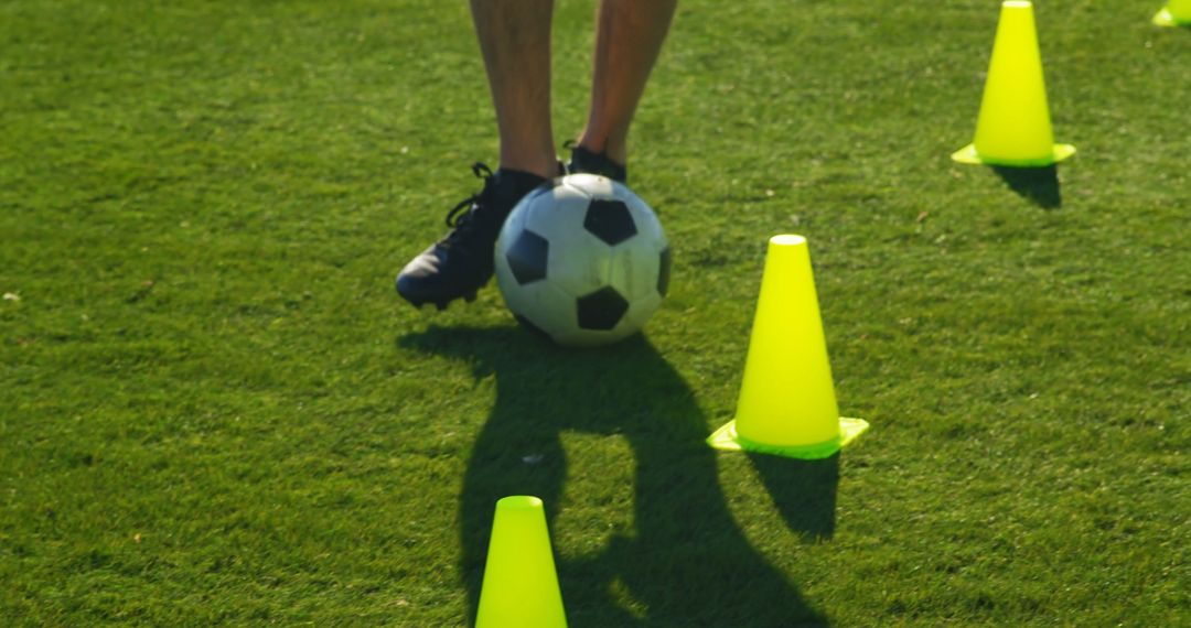 Soccer Player Practicing Dribbling Skills with Training Cones - Free Images, Stock Photos and Pictures on Pikwizard.com