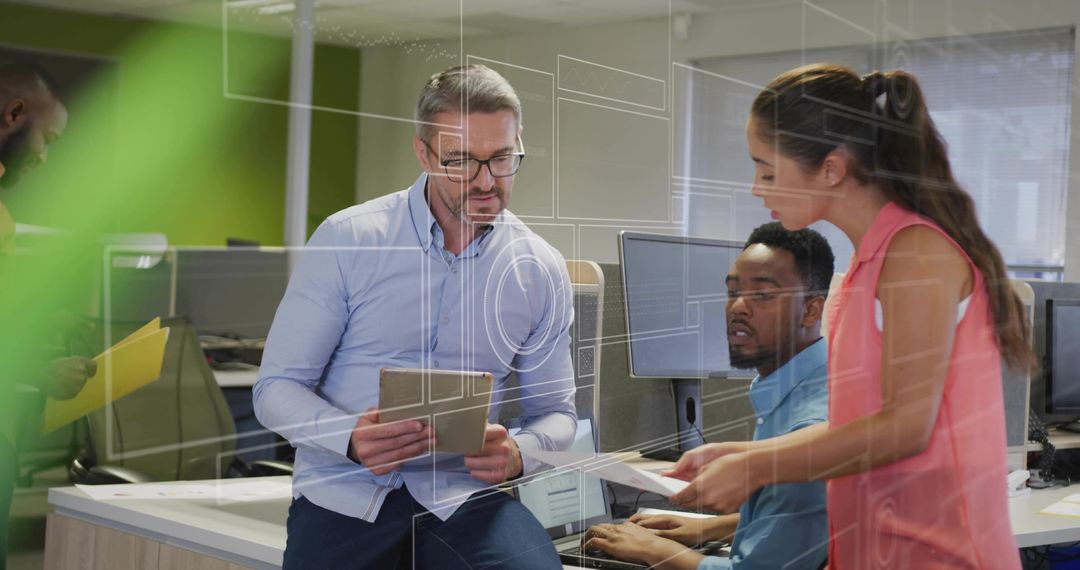 Multicultural team collaborating over tablet and documents in modern open-plan office