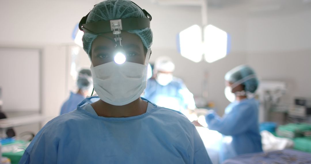 Portrait of diverse surgeons with face masks during surgery in operating room - Free Images, Stock Photos and Pictures on Pikwizard.com