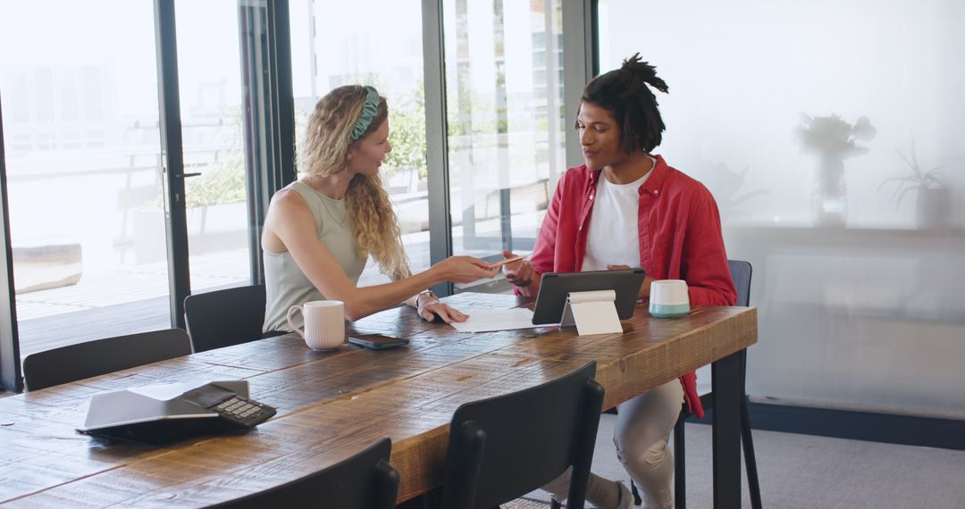 Colleagues Discussing Project Ideas at Office Meeting
