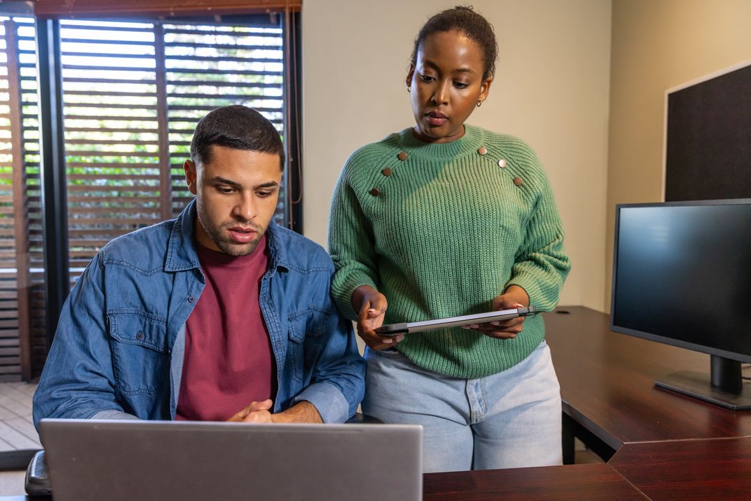 Diverse Coworkers Collaborating at Workspace