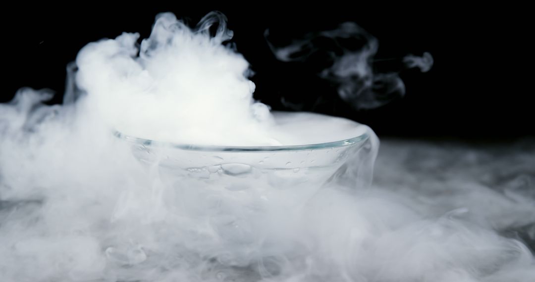 Dry ice creates a dramatic, contrasting fog around a clear glass bowl. - Free Images, Stock Photos and Pictures on Pikwizard.com
