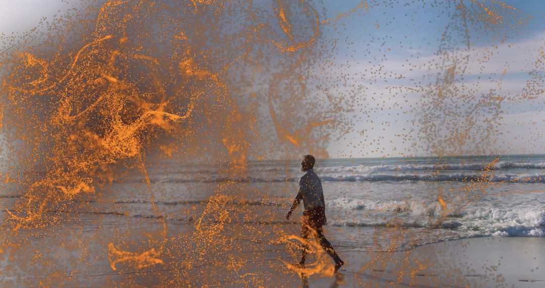 Man Walking Along Ocean Shoreline Overlapped with Abstract Orange Sparks