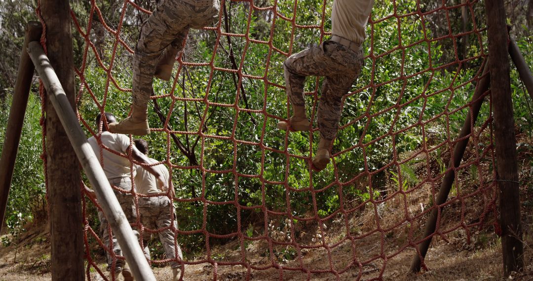 Soldiers Navigating Forest Obstacle Course for Team Training