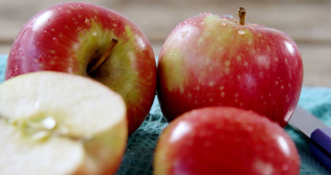 Fresh Red Apples on Wooden Surface Highlighting Health Benefits