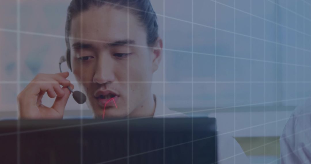 Young Business Professional Using Headset at Work