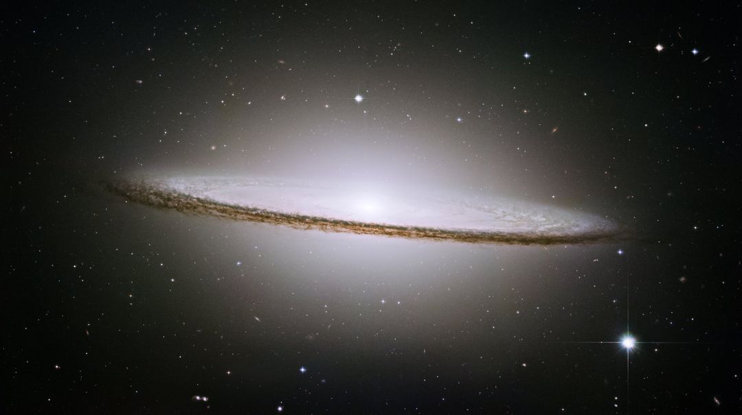 Glowing Sombrero Galaxy with Bright Halo in Deep Space - Free Images, Stock Photos and Pictures on Pikwizard.com