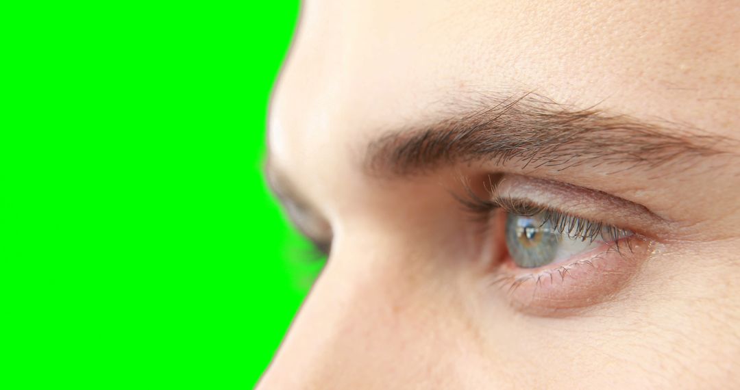 Close-up of Blue Eyes and Eyebrows with Green Background - Free Images, Stock Photos and Pictures on Pikwizard.com