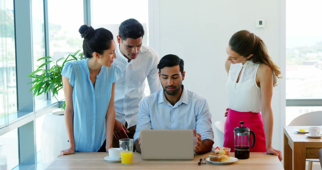 Diverse Professionals Collaborating at Office Breakfast Meeting