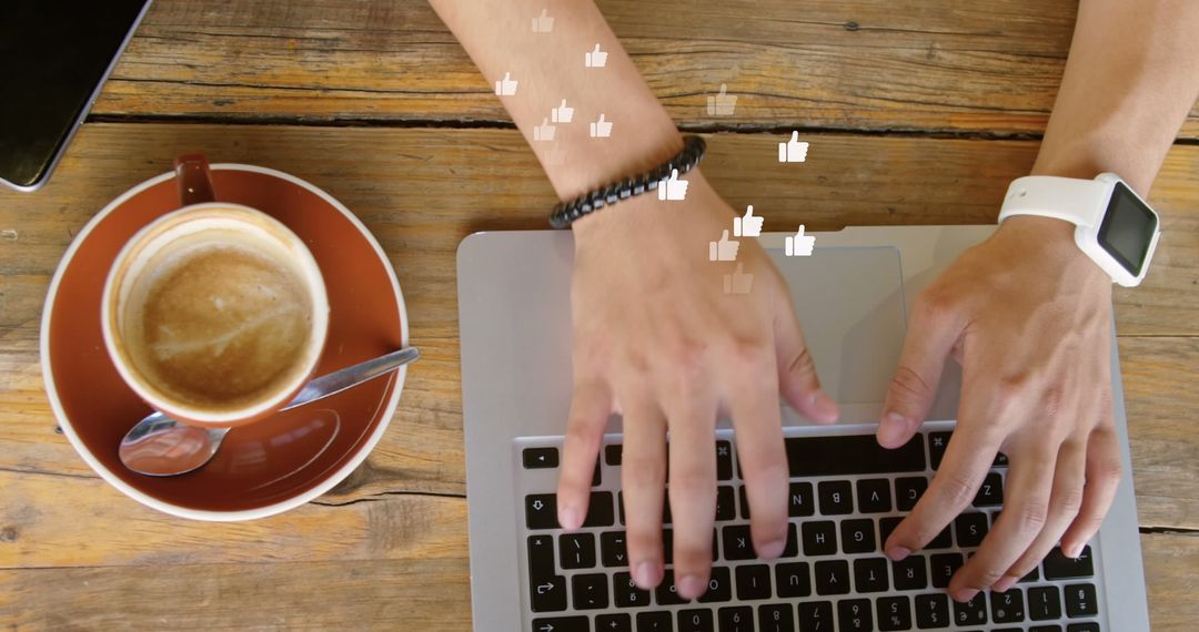 Person Typing on Laptop with Coffee and Smartwatch