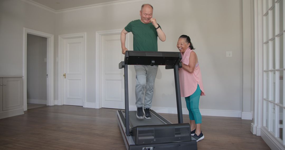 Elderly Couple Enjoying Home Exercise on Treadmill