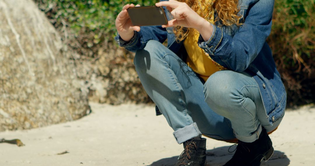 Caucasian Woman Captures Summer Beach Moments on Smartphone - Free Images, Stock Photos and Pictures on Pikwizard.com