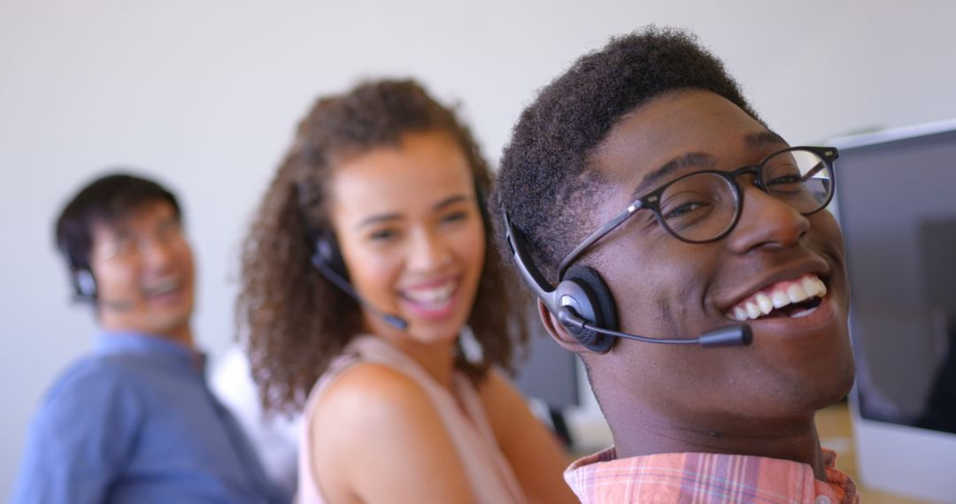 Diverse Customer Support Team Smiling in Modern Office