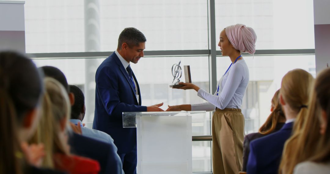 Businessman Presenting Award to Woman at Business Conference Event - Free Images, Stock Photos and Pictures on Pikwizard.com