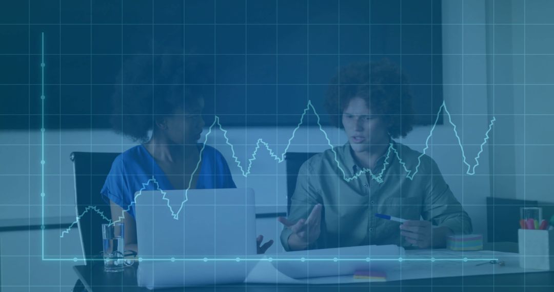 Diverse Colleagues Discussing Financial Data in Office