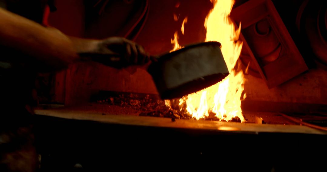 Blacksmith Holding Metal Pot in Forge - Free Images, Stock Photos and Pictures on Pikwizard.com