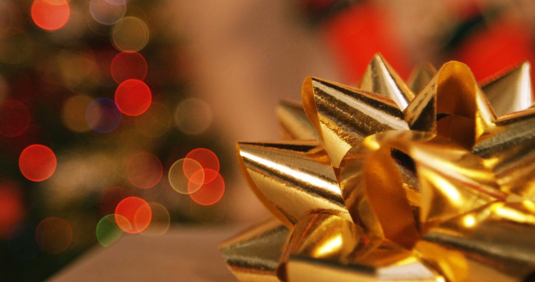 Close-Up of Gold Bow with Colorful Bokeh Lights - Free Images, Stock Photos and Pictures on Pikwizard.com