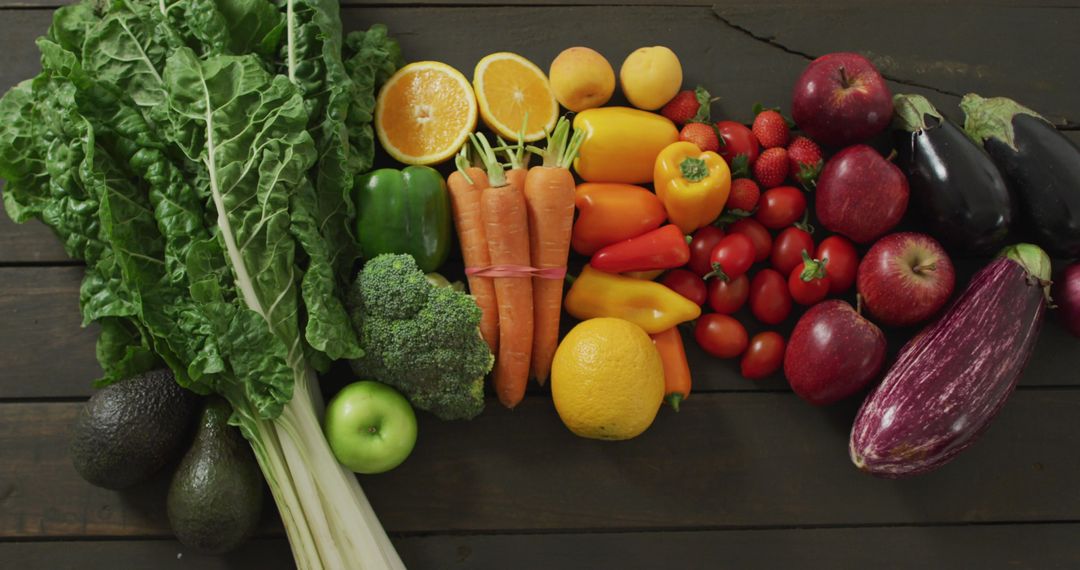 Assorted Colorful Fresh Vegetables and Fruits on Wooden Surface